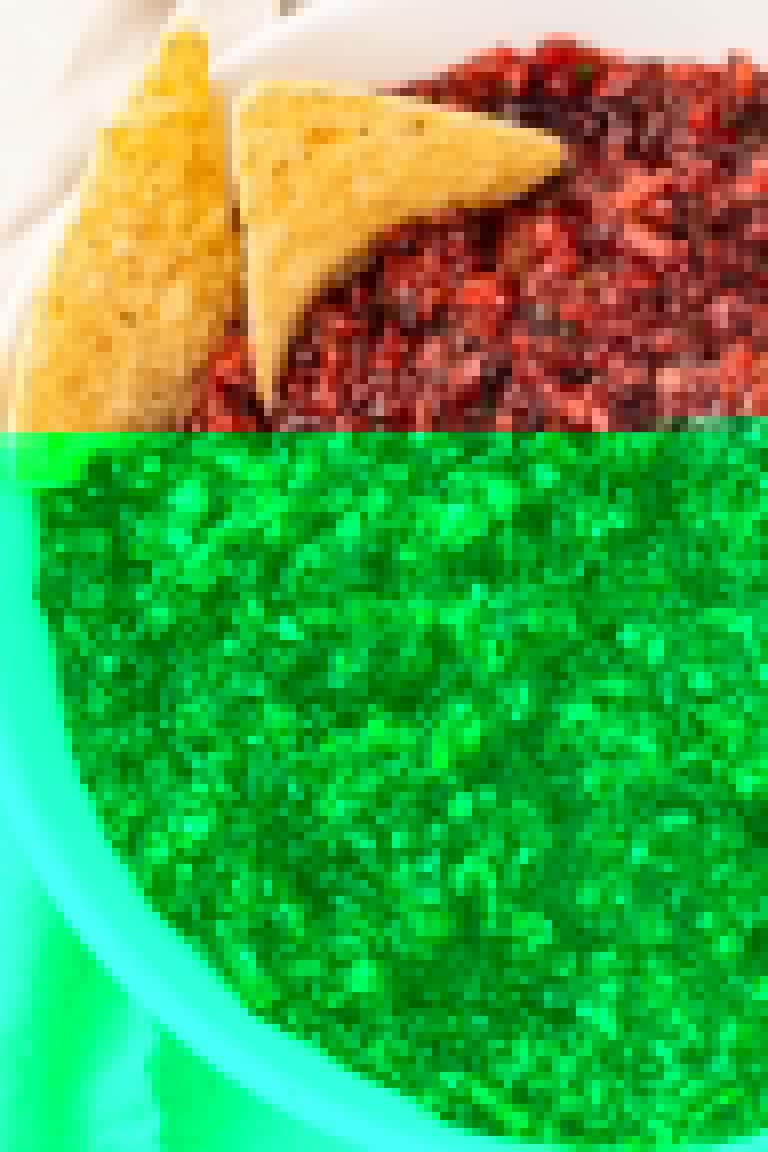 A large bowl of cranberry salsa with tortilla chips